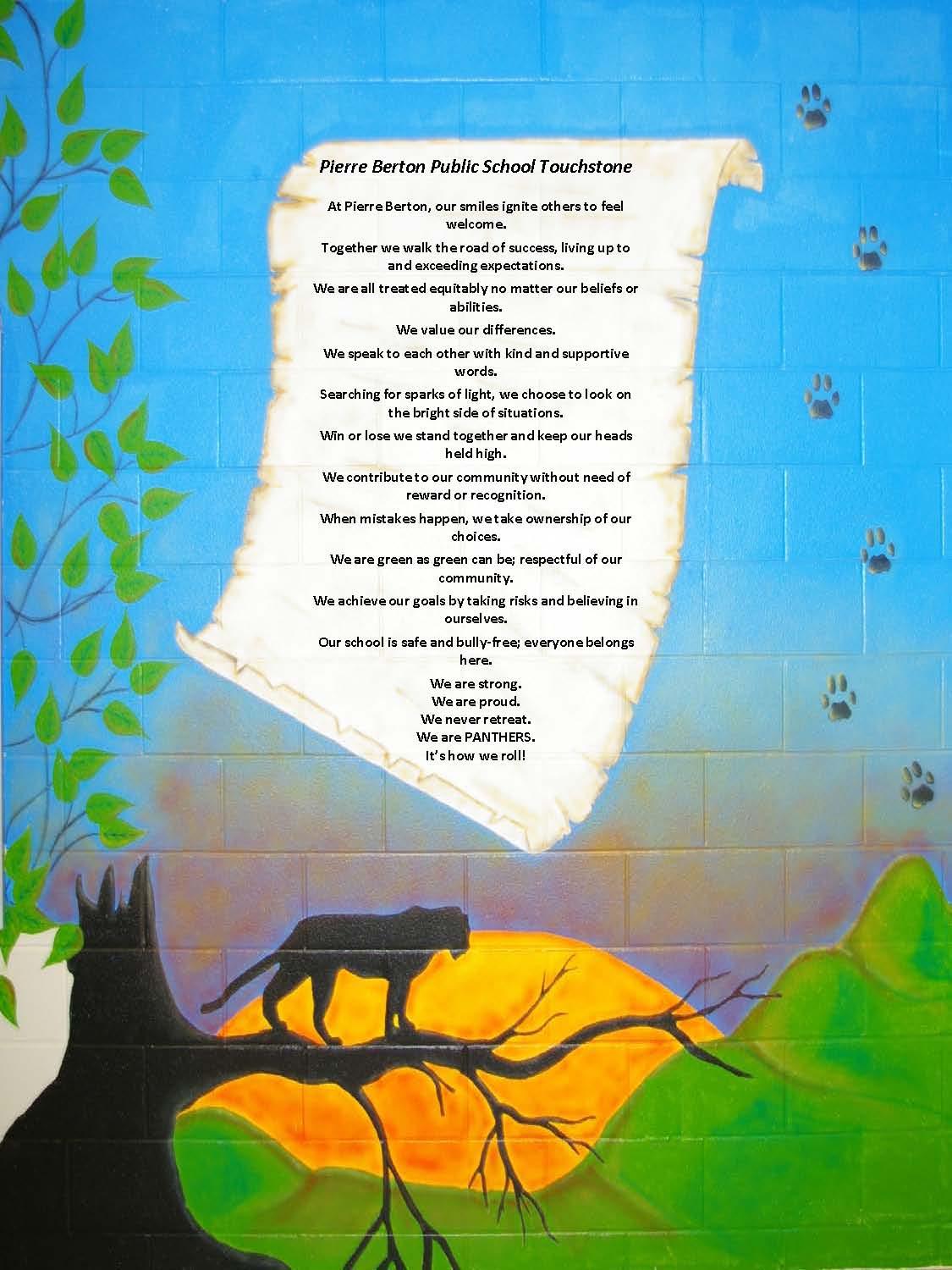 Words of school touchstone painted on wall. Words appear on a scroll. Background looks like a blue sky. A panther sits on a tree branch beneath the scroll with green hills and a sunset behind it. 